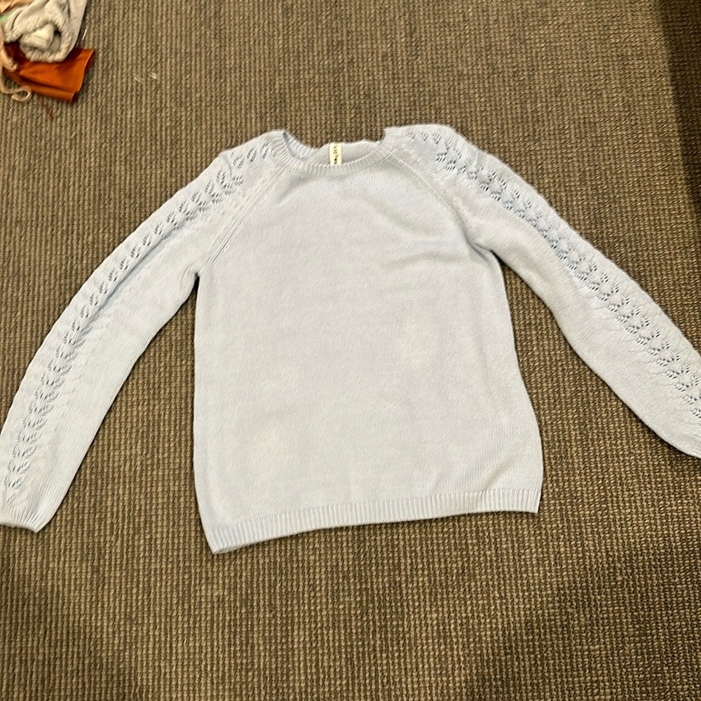 blue knit sweatshirt